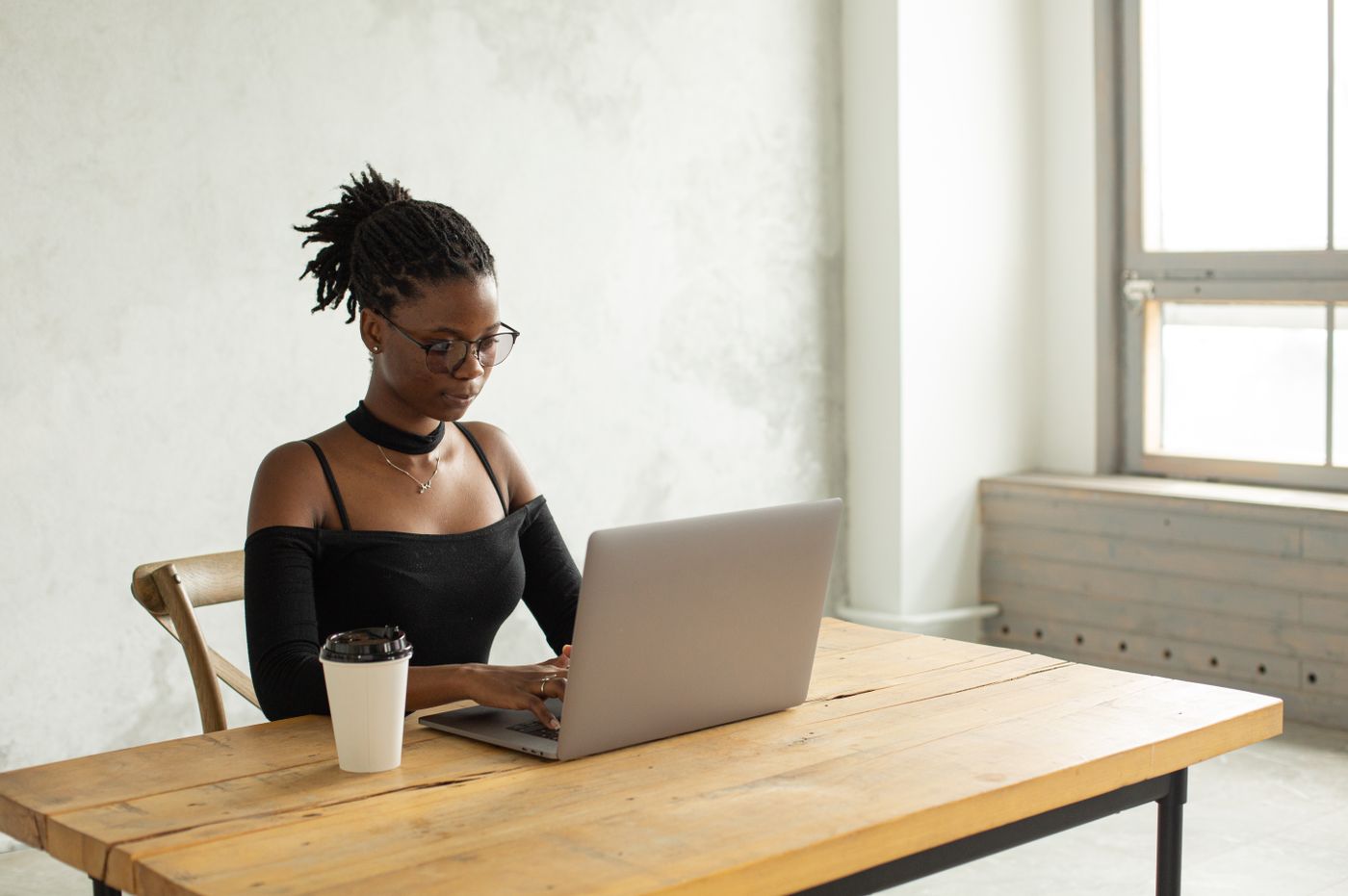 Candidate reviewing job opportunities on a laptop